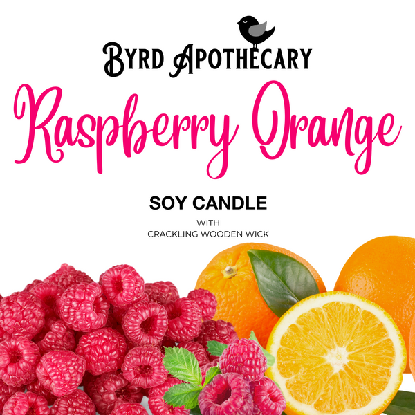 Graphic of Byrd Apothecary Raspberry Orange Soy Candle with crackling Wooden Wick. The background is a bunch of fresh red raspberries with whole and cut oranges.