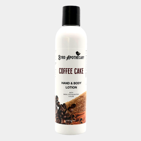 Photo of Byrd Apothecary Coffee Cake Hand & Body Lotion - with Shea, Cocoa Butter & Aloe. The label background is whole coffee beans, a mound of brown sugar and cinnamon sticks.