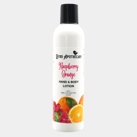 Photo of Byrd Apothecary Raspberry Orange Hand & Body Lotion - with Shea, Cocoa Butter & Aloe. The label background is a bunch of fresh red raspberries with whole and cut oranges.