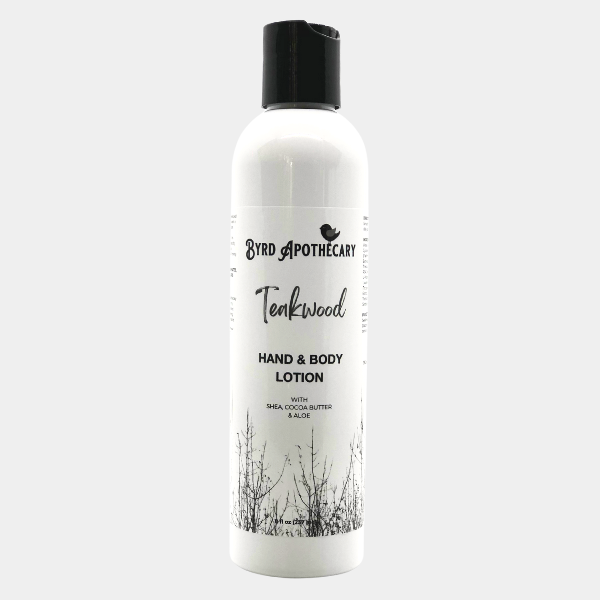 Photo of Byrd Apothecary Teakwood Hand & Body Lotion - with Shea, Cocoa Butter & Aloe. The label background is a black and white photo of leafless trees.